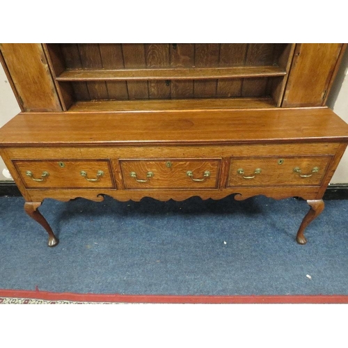 1177 - A 19TH CENTURY OAK COUNTRY DRESSER, having an enclosed plate rack with two crossbanded cupboards, ab... 