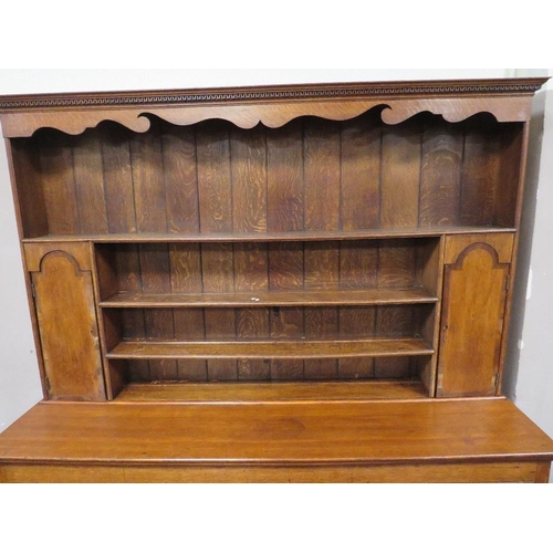 1177 - A 19TH CENTURY OAK COUNTRY DRESSER, having an enclosed plate rack with two crossbanded cupboards, ab... 