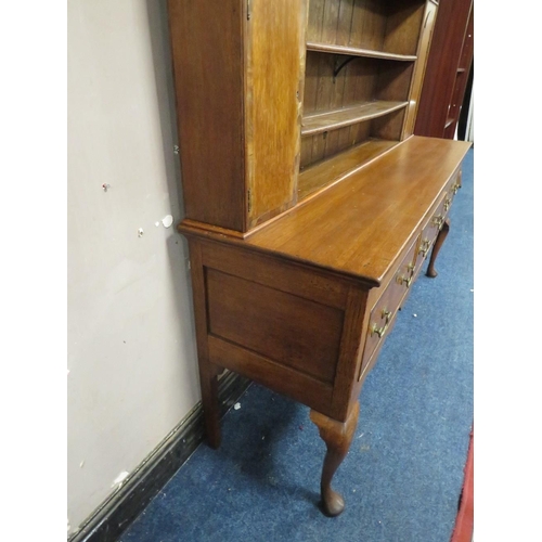 1177 - A 19TH CENTURY OAK COUNTRY DRESSER, having an enclosed plate rack with two crossbanded cupboards, ab... 