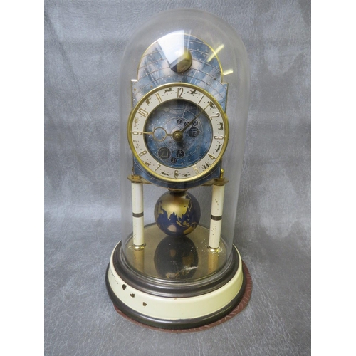 1145 - A 400 DAY KAISER UNIVERSE CLOCK WITH GLASS DOME, having a world globe rotating pendulum and upper mo... 