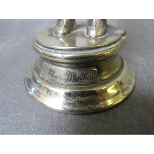 869 - A VINTAGE SILVER PLATED FRY'S 'HELLO DADDY' ADVERTISING FIGURE, on a circular plinth, H 18.5 cm