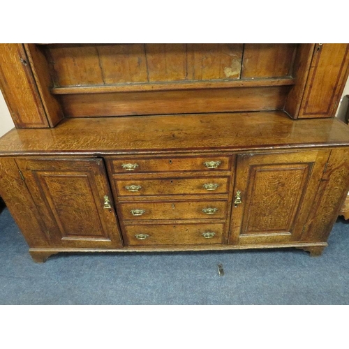 1181 - A GEORGIAN OAK CROSSBANDED WELSH DRESSER, the enclosed upper section with two crossbanded cupboards,... 