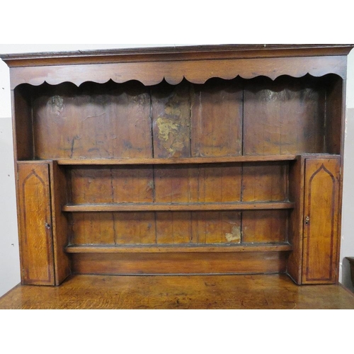 1181 - A GEORGIAN OAK CROSSBANDED WELSH DRESSER, the enclosed upper section with two crossbanded cupboards,... 