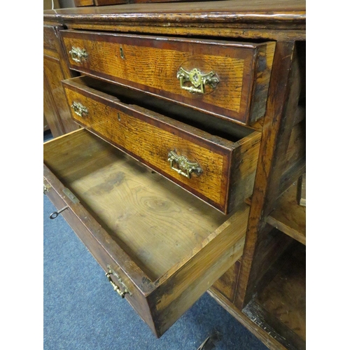 1181 - A GEORGIAN OAK CROSSBANDED WELSH DRESSER, the enclosed upper section with two crossbanded cupboards,... 