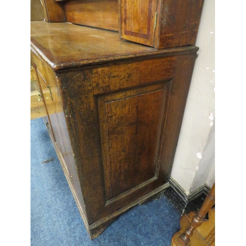 1181 - A GEORGIAN OAK CROSSBANDED WELSH DRESSER, the enclosed upper section with two crossbanded cupboards,... 