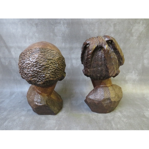 1087 - A PAIR OF CARVED IRONWOOD STUDIES OF AN AFRICAN MAN AND WOMAN, tallest H 32 cm