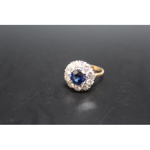 640 - AN 18CT AND PLATINUM SAPPHIRE AND DIAMOND RING, the central sapphire being of an estimated 2.54 cara... 