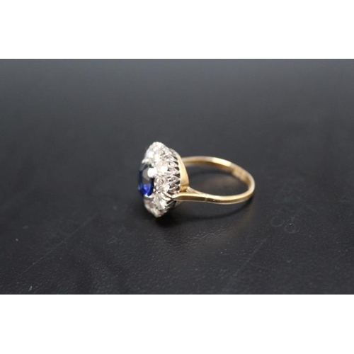 640 - AN 18CT AND PLATINUM SAPPHIRE AND DIAMOND RING, the central sapphire being of an estimated 2.54 cara... 