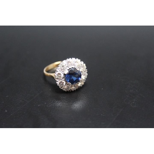 640 - AN 18CT AND PLATINUM SAPPHIRE AND DIAMOND RING, the central sapphire being of an estimated 2.54 cara... 