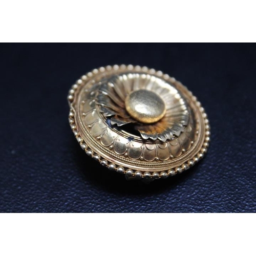 650 - A YELLOW METAL MOURNING BROOCH IN THE FORM OF A DAISY, one petal missing, in unmarked yellow metal, ... 