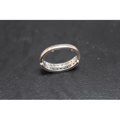 651 - A TWIN ROW DIAMOND SET HALF ETERNITY RING, looks to have had a replacement shank with two resizing n... 