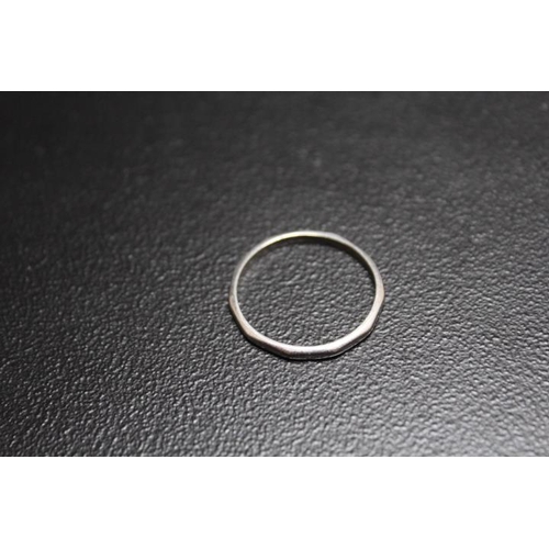 660 - A FACETED PLATINUM WEDDING BAND, stamped PLAT, approx weight 3.1g, ring size T 1/2