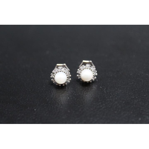 662 - A PAIR OF HALLMARKED 9 CARAT GOLD PEARL AND DIAMOND EARRINGS, approx weight 2.2g, Dia 1 cm