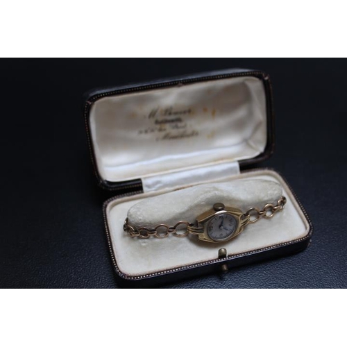 745 - A 9 CARAT GOLD WRIST WATCH IN PRESENTATION BOX, approx weight 12.6g, D 1.75 cm