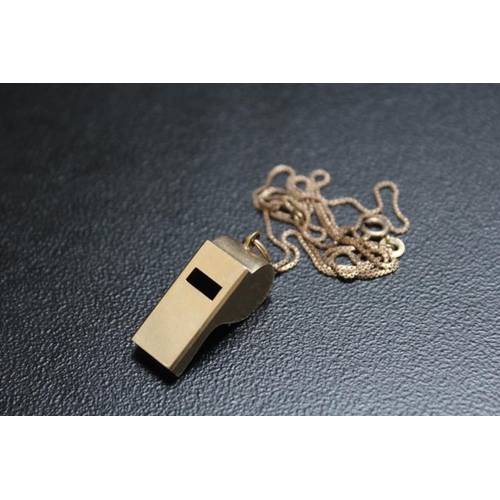 675 - A NOVELTY HALLMARKED 9 CARAT GOLD PENDANT IN THE FORM OF A WHISTLE, on a 9 ct gold chain, approx com... 