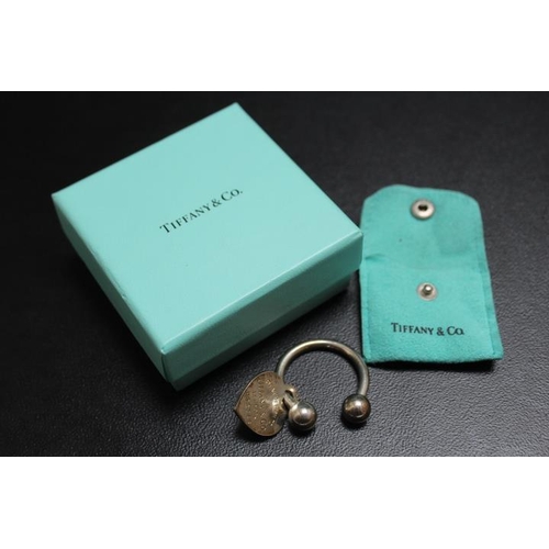 688 - A TIFFANY & CO SILVER KEY RING HOLDER WITH HEART SHAPED TAG, complete with a box and a bag, approx w... 