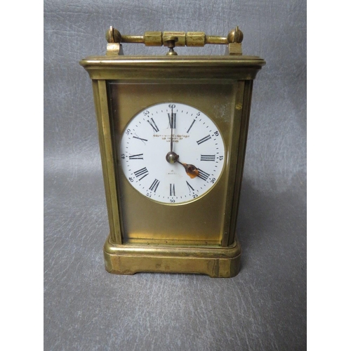 1148 - A SMALL 19TH CENTURY FRENCH REPEATER BRASS CARRIAGE CLOCK, with swing handle, H 14.5 cm