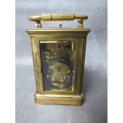 1148 - A SMALL 19TH CENTURY FRENCH REPEATER BRASS CARRIAGE CLOCK, with swing handle, H 14.5 cm