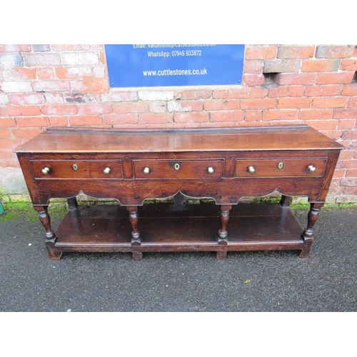 1170 - A 19TH CENTURY OAK DRESSER - POSSIBLY SHROPSHIRE, having three frieze drawers above a shaped apron, ... 