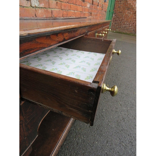 1170 - A 19TH CENTURY OAK DRESSER - POSSIBLY SHROPSHIRE, having three frieze drawers above a shaped apron, ... 