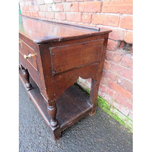 1170 - A 19TH CENTURY OAK DRESSER - POSSIBLY SHROPSHIRE, having three frieze drawers above a shaped apron, ... 