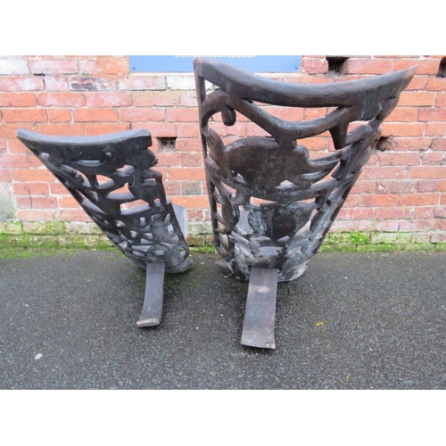 1044 - TWO HEAVILY CARVED AFRICAN TRIBAL CHAIRS