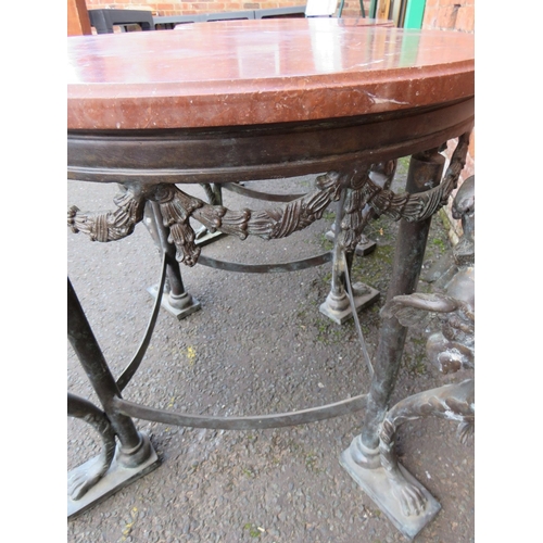 1173 - A PAIR OF 19TH CENTURY BRONZE AND MARBLE TOPPED TABLES IN THE EMPIRE STYLE, each with four winged fi... 