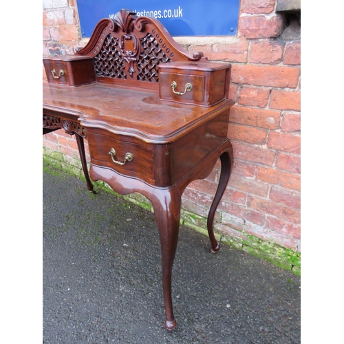 1167 - A LATE 19TH CENTURY MAHOGANY LADIES WRITING DESK, having a shaped inset leather writing surface, car... 