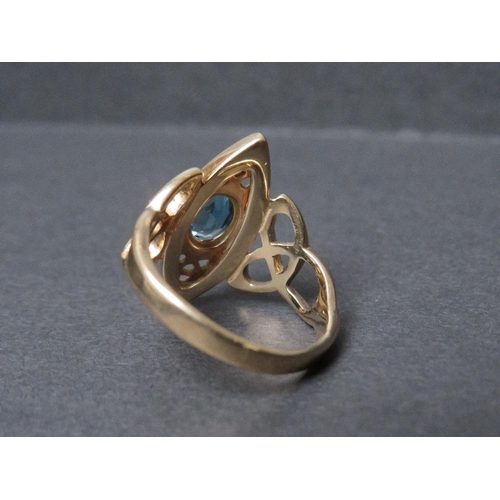 691 - A VINTAGE CLOGAU GOLD LADIES 9CT GOLD LADIES DRESS RING, of Celtic design, set with blue stone, ring... 