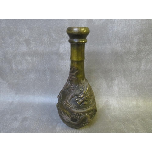 1035 - AN ORIENTAL BRONZE ONION SHAPED VASE, decorated with a five claw dragon in relief, with a four chara... 