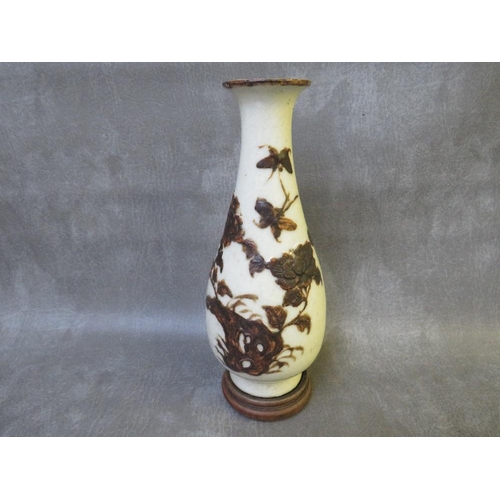 1036 - AN ORIENTAL STYLE PORCELAIN BALUSTER VASE, with floral applied detail, raised on a hardwood plinth, ... 