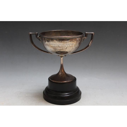 814 - A HALLMARKED SILVER TWIN HANDLED TROPHY ON STAND, Sheffield assay with presentation inscription, app... 