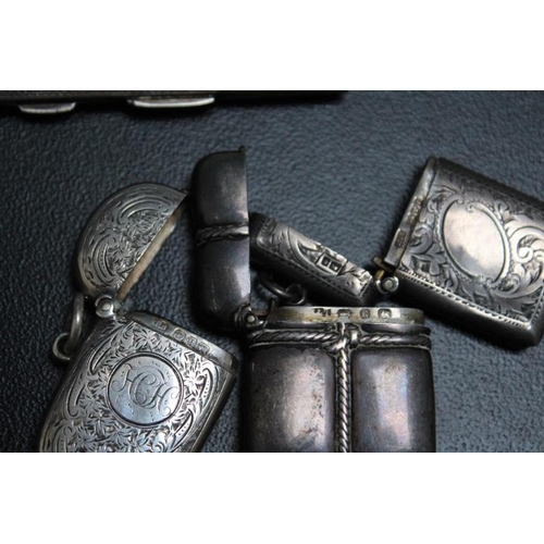 817 - THREE HALLMARKED SILVER VESTA CASES, together with two hallmarked silver cigarette cases, various da... 