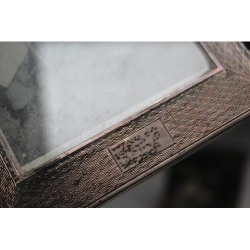 806 - A MATCHING SET OF THREE HALLMARKED SILVER ART DECO STYLE PHOTO FRAMES BY ERNEST WILFRED SANDERS & HE... 