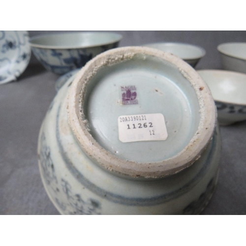 1028 - A COLLECTION OF NINE TEK SING CARGO BLUE AND WHITE BOWLS, together with a shallow saucer, all with N... 