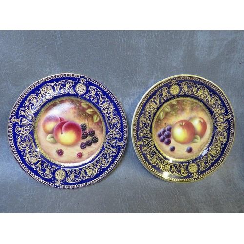 1024 - A PAIR OF ROYAL WORCESTER SANDRINGHAM PAINTED FRUIT COBALT BLUE CABINET PLATES SIGNED S. SMITH, gilt... 