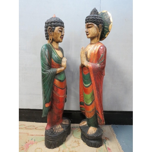 1072 - TWO LARGE CARVED WOOD POLYCHROME ORIENTAL DEITY FIGURINES, circa 1960s, in majestic standing pose, t... 