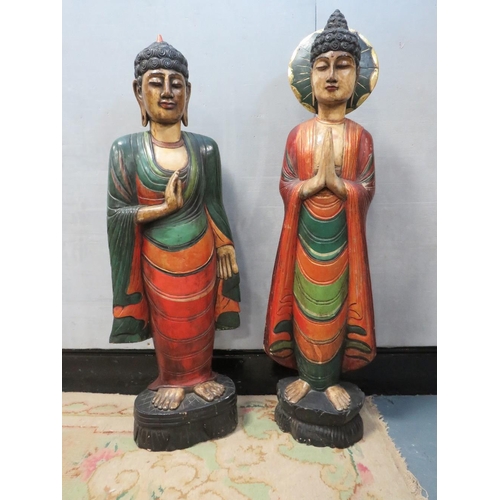 1072 - TWO LARGE CARVED WOOD POLYCHROME ORIENTAL DEITY FIGURINES, circa 1960s, in majestic standing pose, t... 