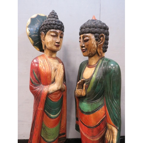 1072 - TWO LARGE CARVED WOOD POLYCHROME ORIENTAL DEITY FIGURINES, circa 1960s, in majestic standing pose, t... 