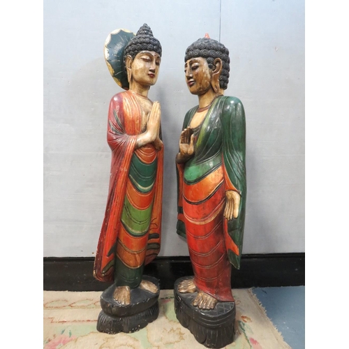 1072 - TWO LARGE CARVED WOOD POLYCHROME ORIENTAL DEITY FIGURINES, circa 1960s, in majestic standing pose, t... 