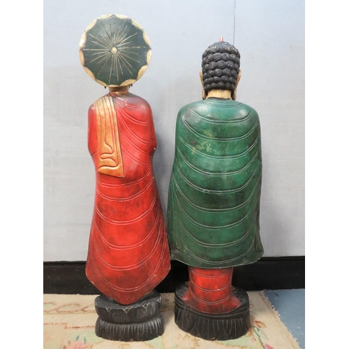 1072 - TWO LARGE CARVED WOOD POLYCHROME ORIENTAL DEITY FIGURINES, circa 1960s, in majestic standing pose, t... 