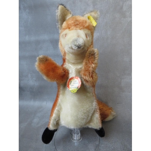 566 - TWO VINTAGE STEIFF BEARS, to include an unusual fox hand puppet with original tag and button in ear,... 