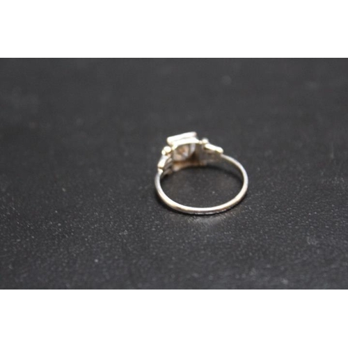 703 - A VINTAGE PLATINUM DIAMOND SOLITAIRE RING, set with a brilliant cut diamond of an estimated 1 carat ... 