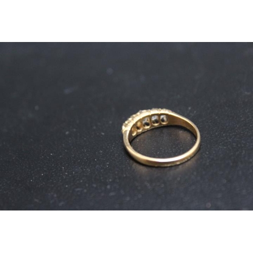 707 - A GRADUATING DIAMOND FIVE STONE RING, set in yellow metal stamped 18, approx weight 3.9g, ring size ... 