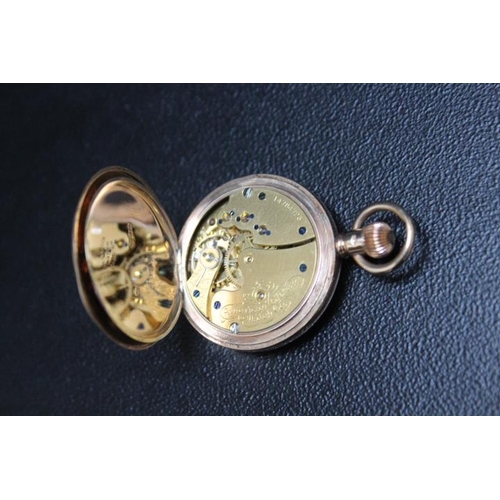 714 - A HALLMARKED 9 CARAT GOLD HALF HUNTER FOB WATCH, on a long muff style gold plated chain with floatin... 