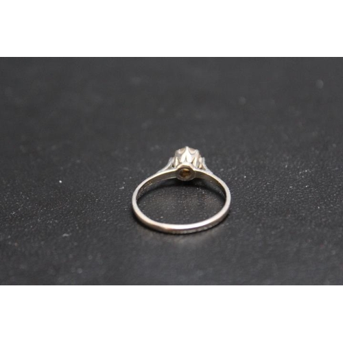 694 - A DIAMOND SOLITAIRE RING, being of an estimated 1 carat and set in 18 carat white gold, approx weigh... 