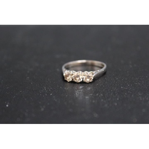 695 - A HALLMARKED 18 CARAT GOLD DIAMOND TRILOGY RING, each diamond being of an estimated quarter carat, a... 