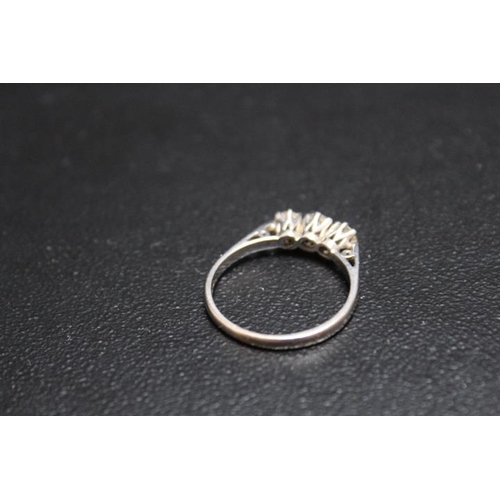 695 - A HALLMARKED 18 CARAT GOLD DIAMOND TRILOGY RING, each diamond being of an estimated quarter carat, a... 