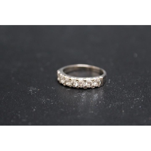 696 - AN 18CT WHITE GOLD SEVEN STONE DIAMOND RING, each diamond being of an estimated 10 pts, approx weigh... 