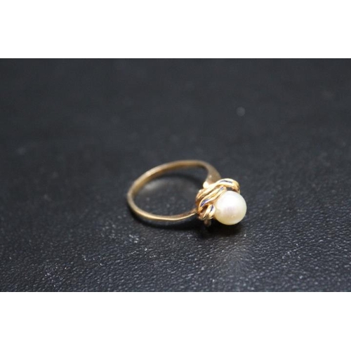 697 - A PEARL RING, set in yellow metal stamped k15 on a 'swirl' bed with blue enamelling, A/F approx weig... 